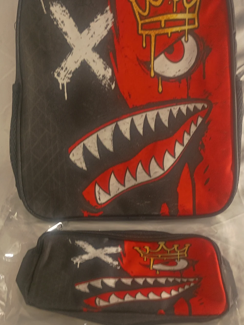 Graphic Shark Face Backpack with Crown and X Design - Black & Red